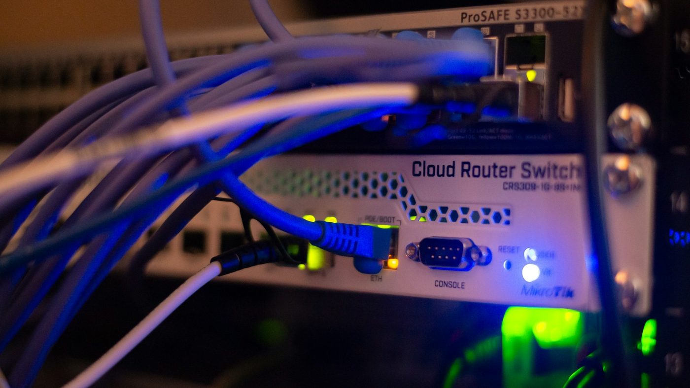 Network cabling connected to a switch in a rack