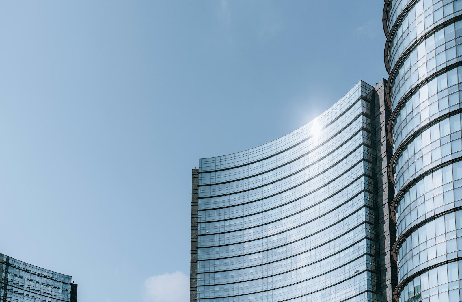 Modern glass office towers seen from below