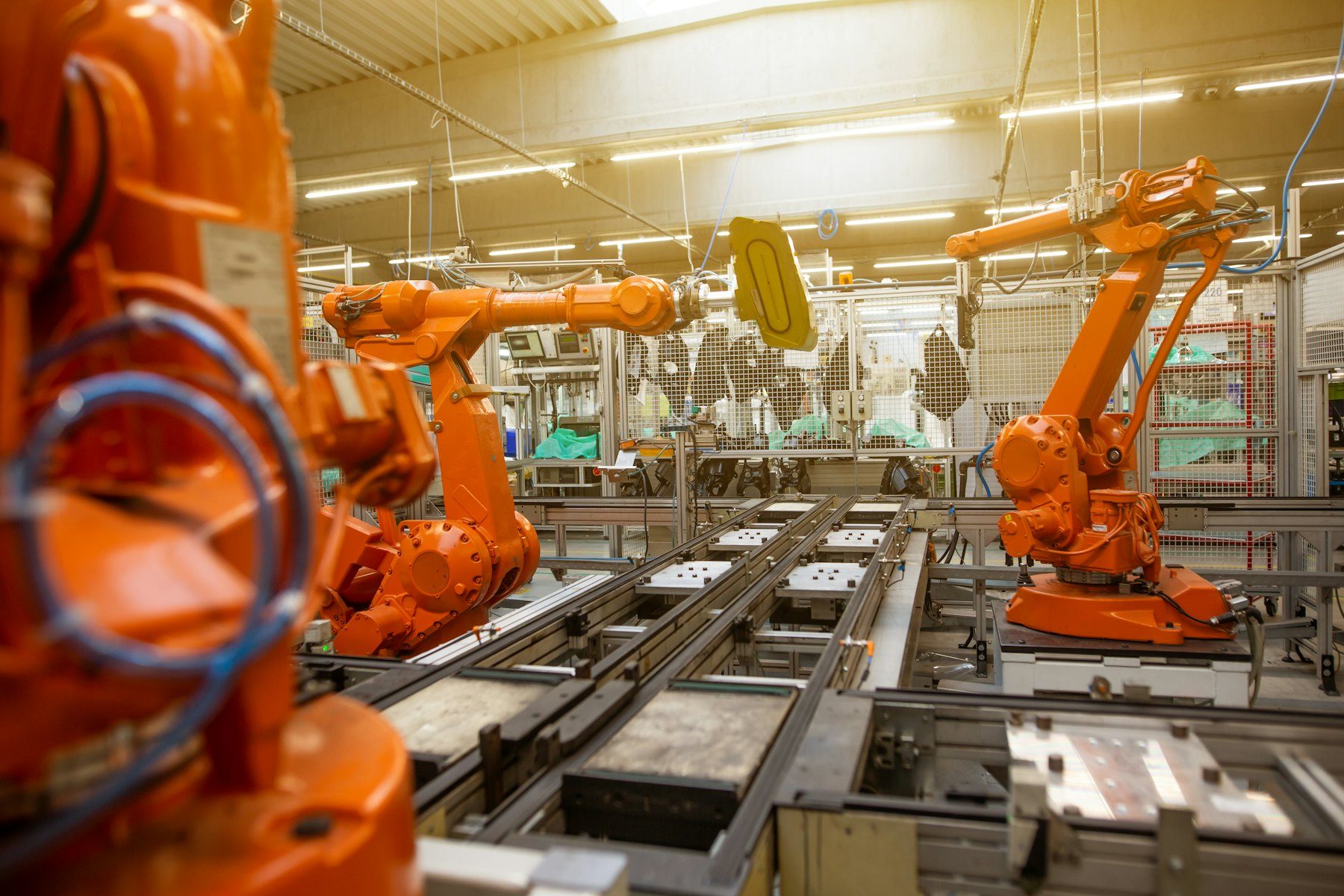 Factory hall filled with orange industrial machines