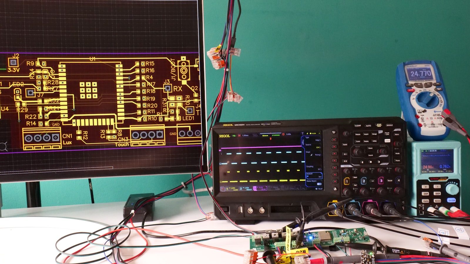 Oscilloscope and test equipment on an electronics bench