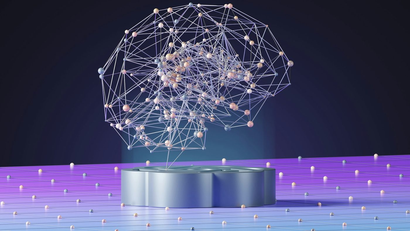 Abstract network of connected nodes above a processor, representing AI-assisted analysis