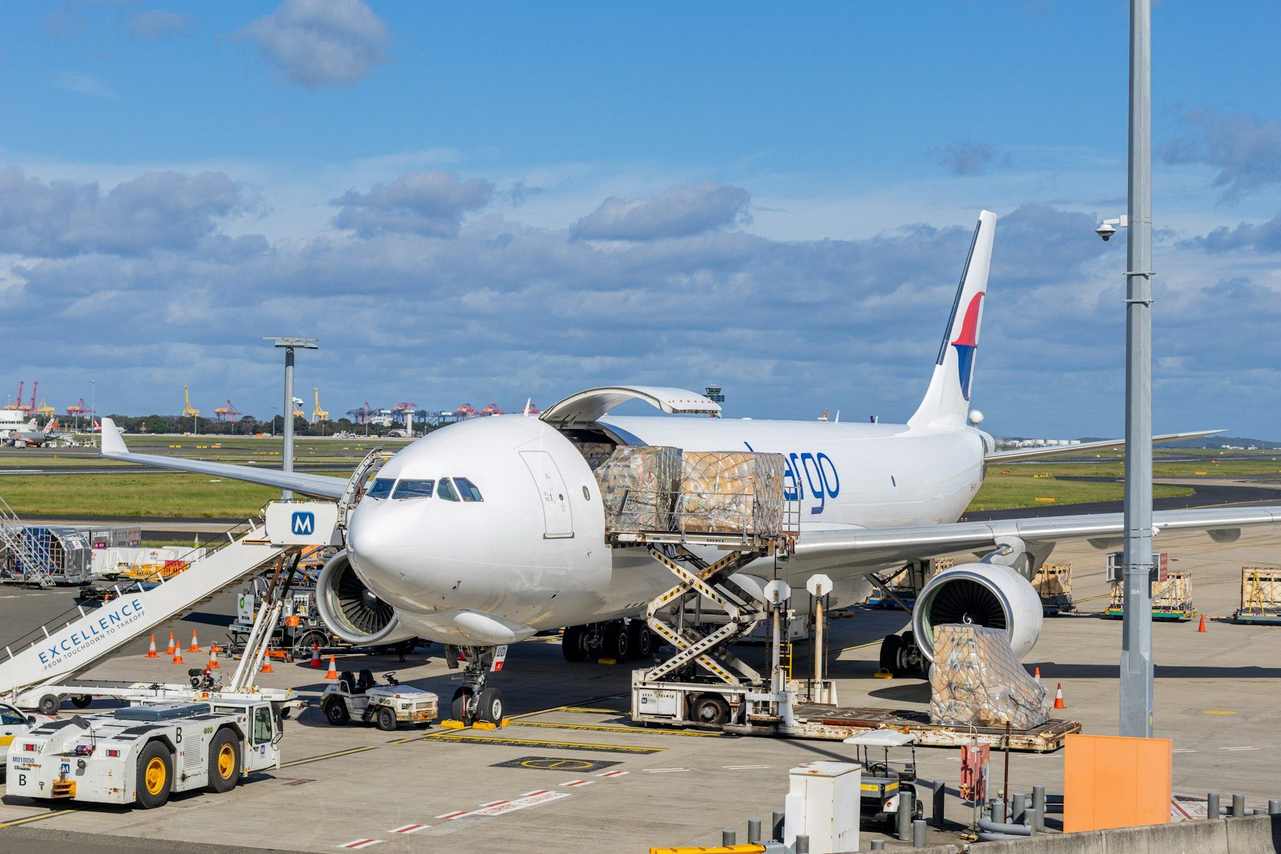 Cargo aircraft being loaded on the tarmac