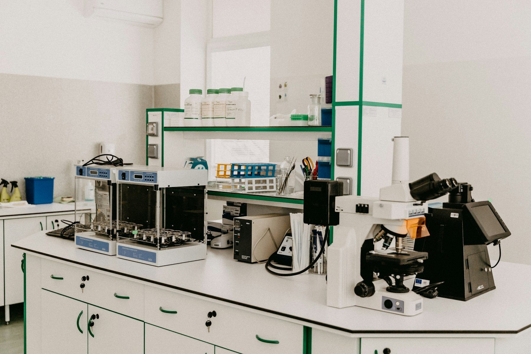 Laboratory workbench with microscopes and analytical equipment