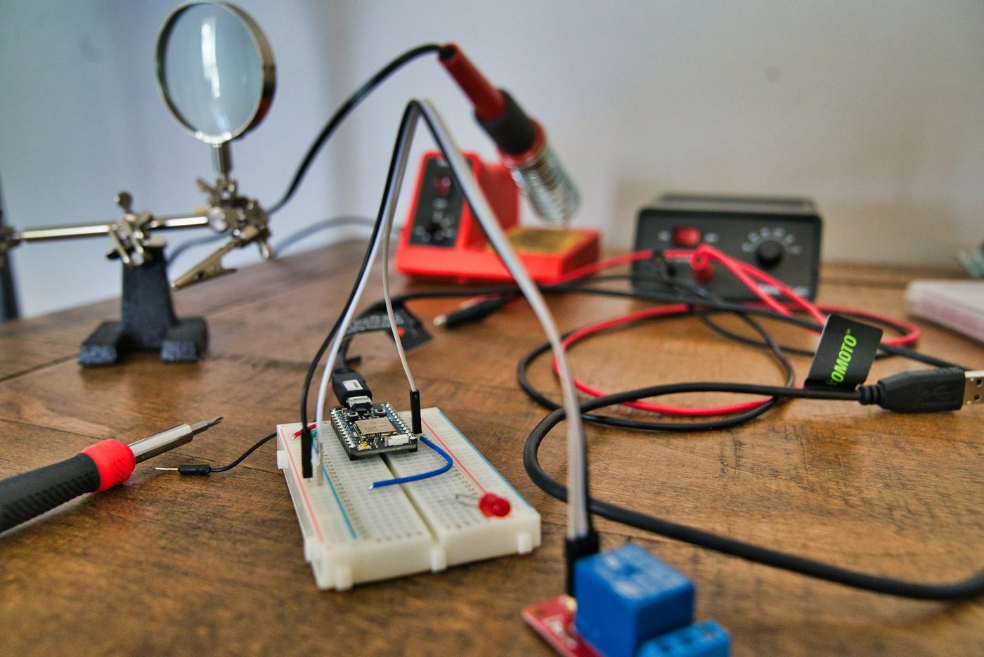 Bench instruments and a multimeter on a workbench